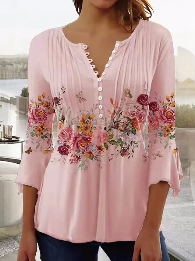 Damebluse med blomsterdesign og elegante knapdetaljer Stilla