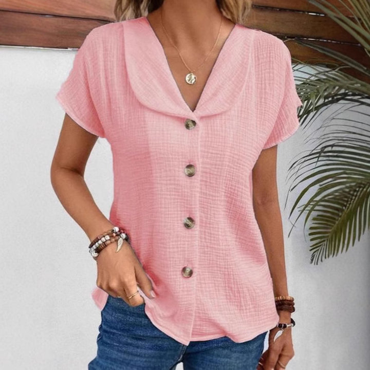 Damebluse med synlige knapper lavet af let stof Stilla