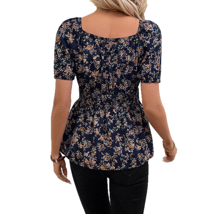 Damebluse med blomsterdesign og elastisk liv Stilla