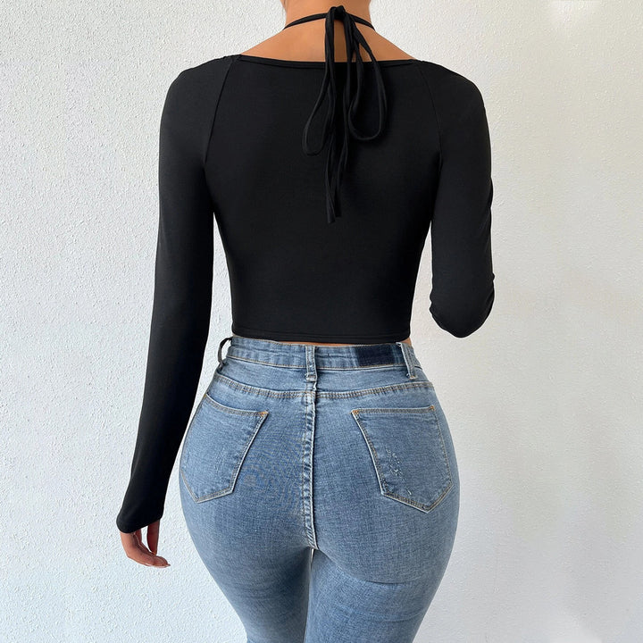 Kvinders langærmet crop top med fashionable krydsdesign og ruching Stilla