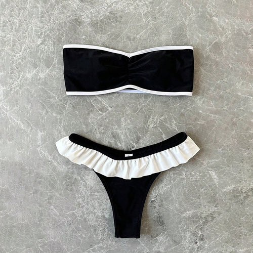 Dame bandeau-bikini med flæsedetaljer og elegant farvekontrast Skovae