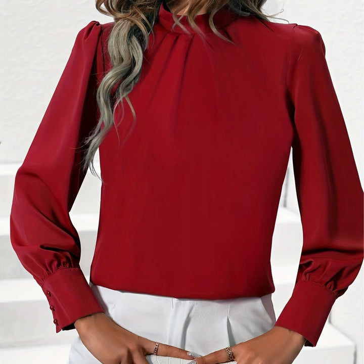 Damebluse med høj krave og elegante puffærmer Stilla