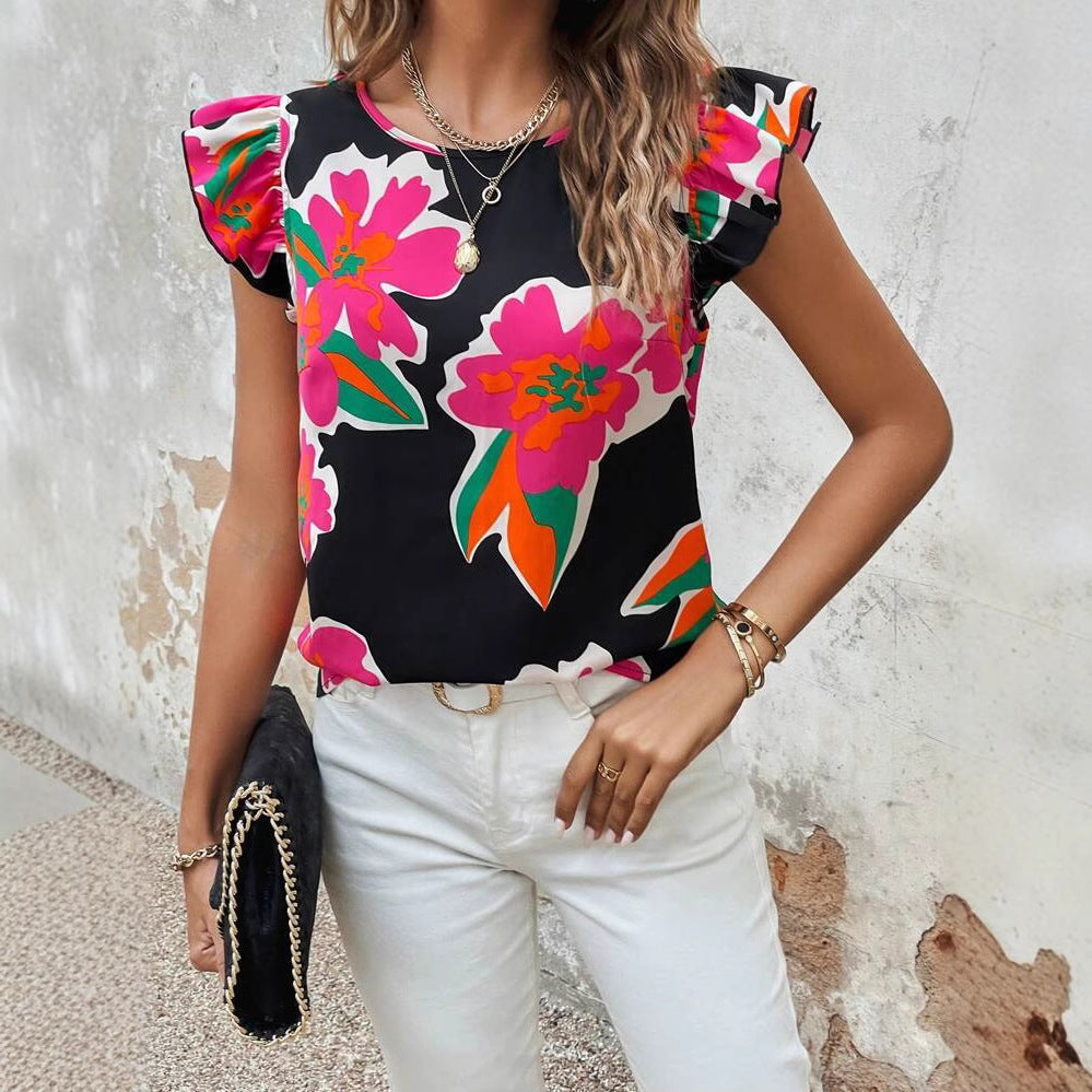 Dame blusenshirt med florale puffærmer og moderne snit Stilla