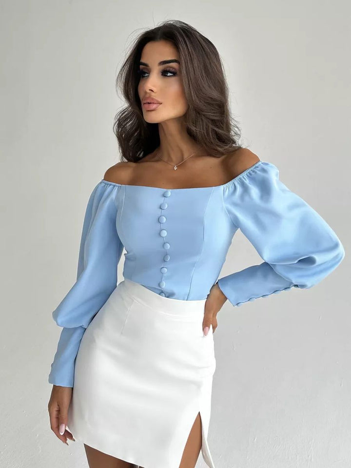 Dame Off-Shoulder Bluse med elegante puffærmer og knapdetaljer Stilla