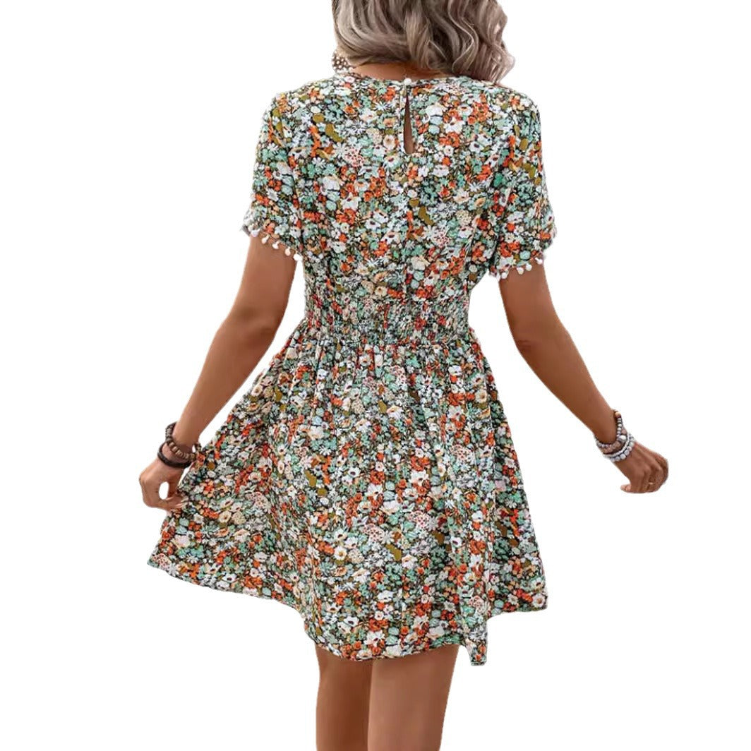 Dame sommerkjole med floral design og elastisk talje Stilla