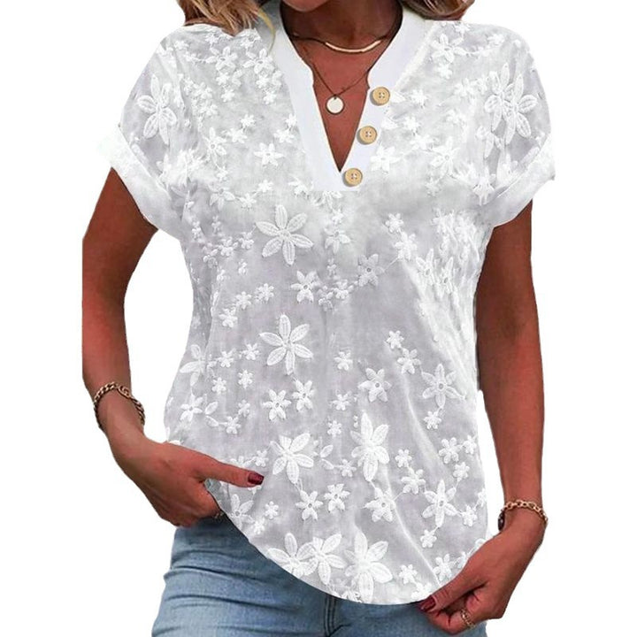 Damebluse med blomsterbroderi-design Stilla