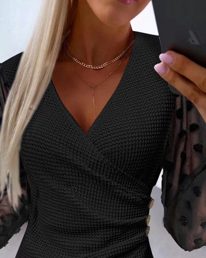 Dame indpakningsbluse med gennemsigtige puffærmer og raffinerede detaljer Stilla