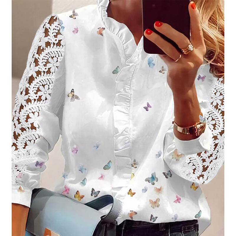 Damebluse med florale applikationer, volangdetaljer og spidsærmer Stilla