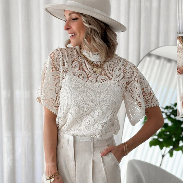 Dame spids top med blomsterlignende hul detaljer Stilla