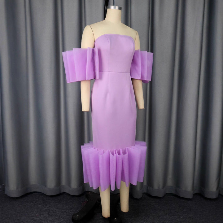 Damer Elegant Midi-kjole med voluminøse flæseærmer og asymmetrisk kant Skovae