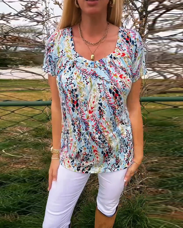 Dame kortærmet bluse med blomstermønster og raffineret snit Stilla