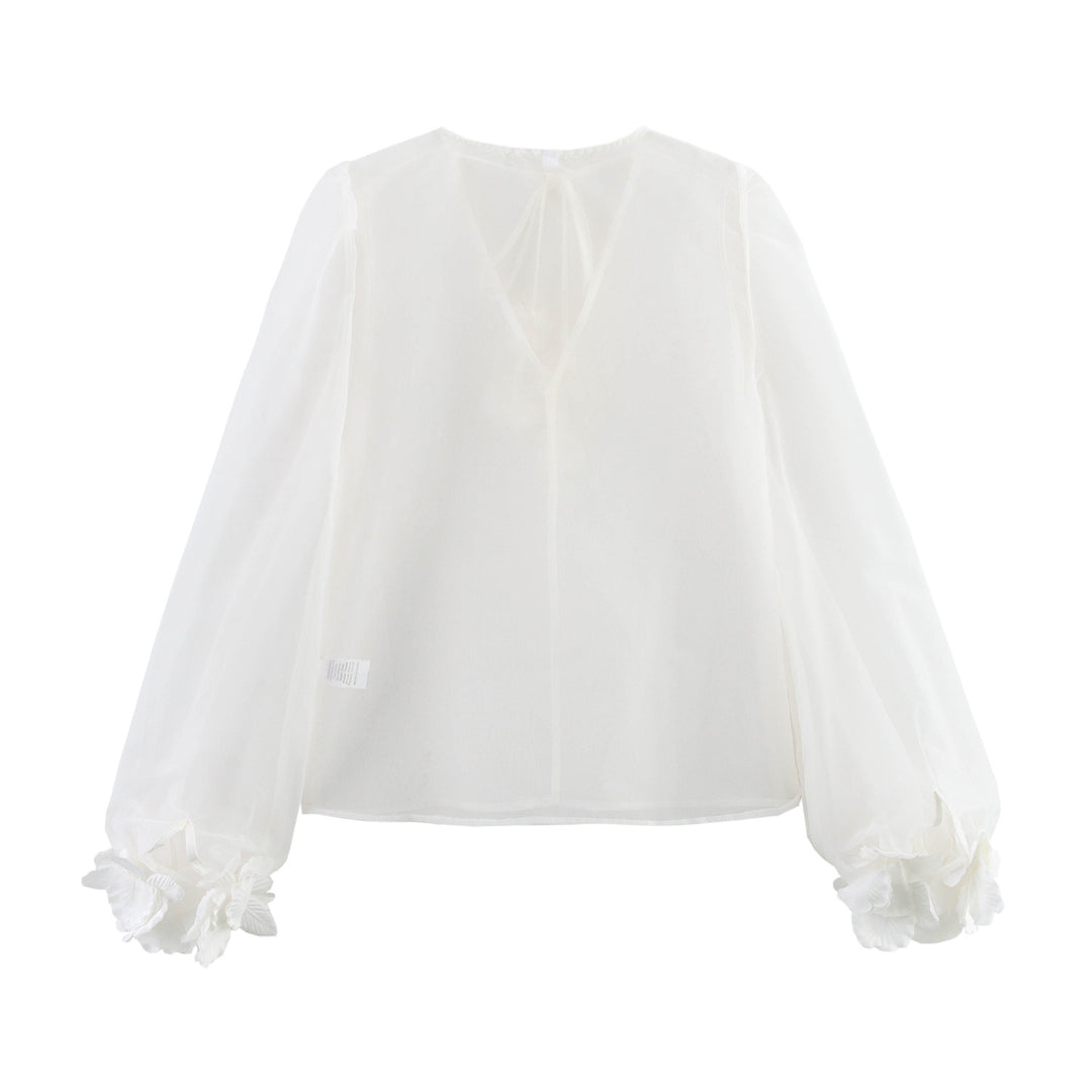 Femme Elegante Transparent Bluse med Puffærmer og Florale Accenter Stilla