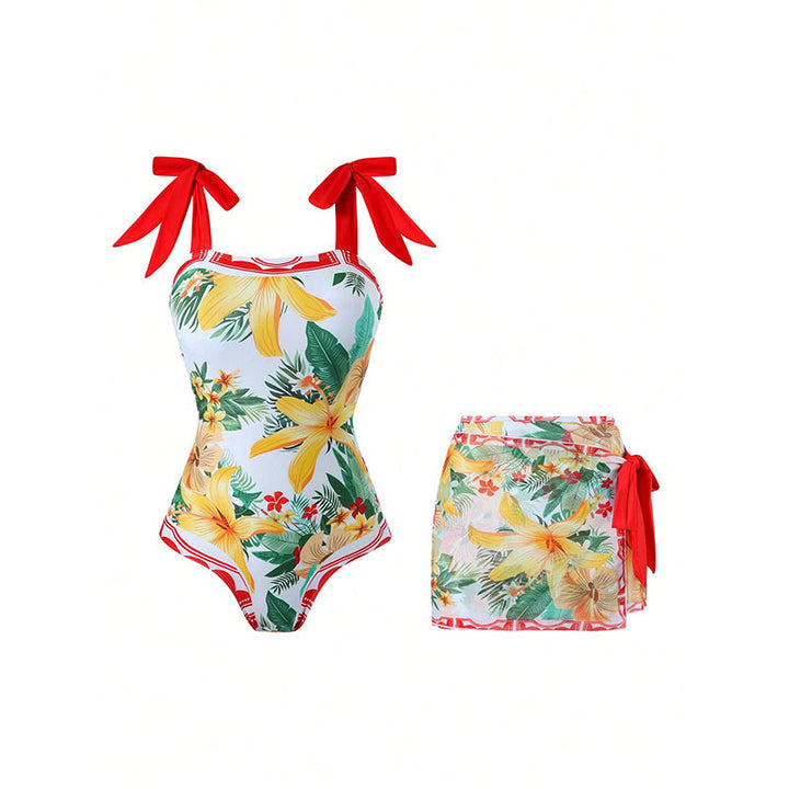 Dame one-piece badedragt med omslagsskørt og legesygt blomsterprint Skovae