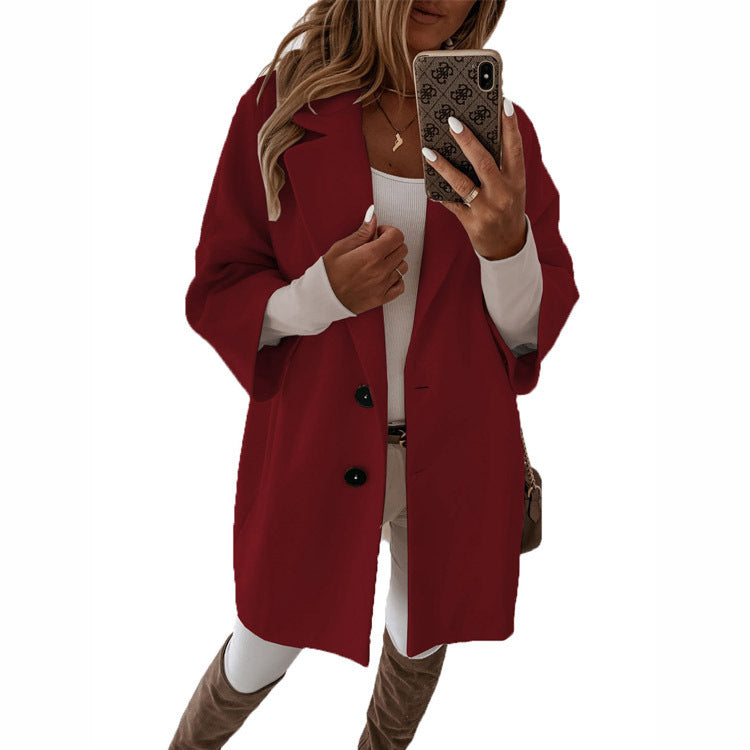 Dame oversized lang jakke med elegante knapdetaljer og afslappet snit Stiila