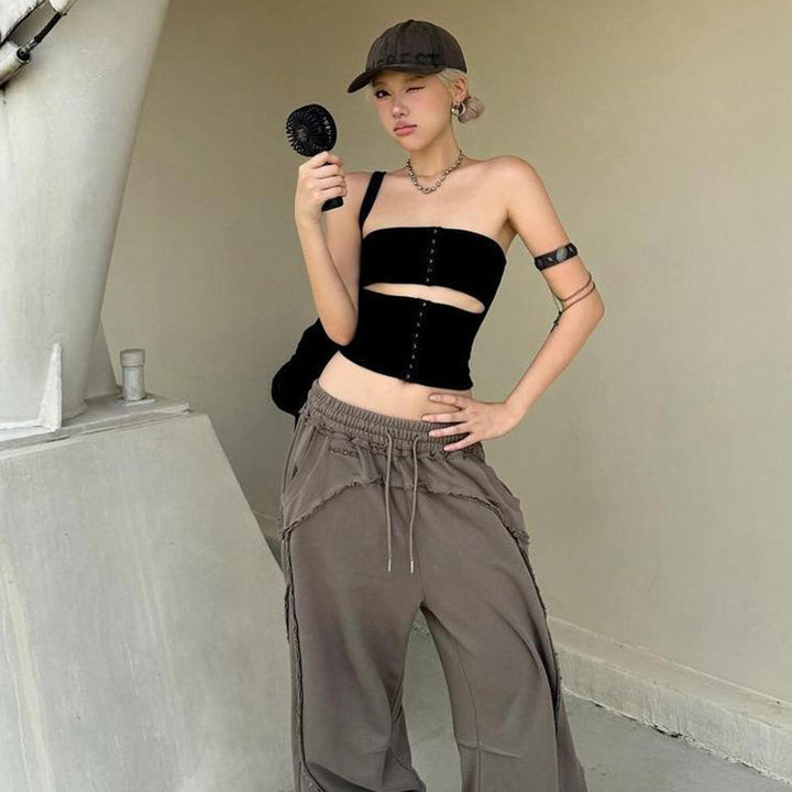 Dame Crop-top med raffineret knapdetalje og frækt design Stilla
