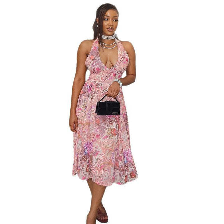 Dame blomster mønster maxi kjole med halter design og flydende silhuet Stilla