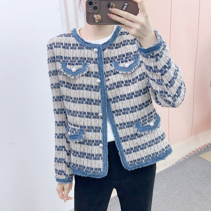 Dame mode Bouclé-jakke med struktureret design og elegante knapdetaljer Stilla