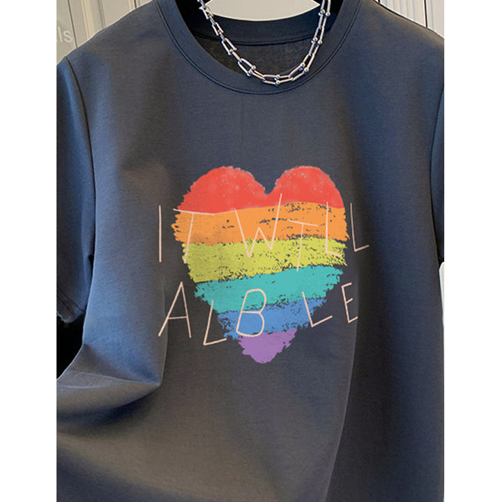 Dame T-shirt med kreativt regnbueskærtsmotiv og inspirerende skrift Stilla