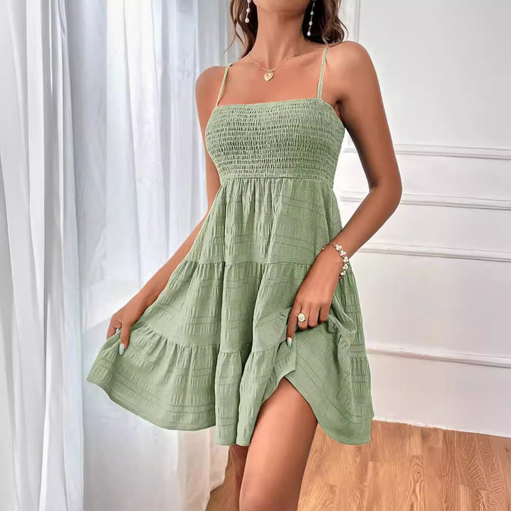 Dame ærmeløs minikjole med svajende skørt og elastisk overdel Stilla
