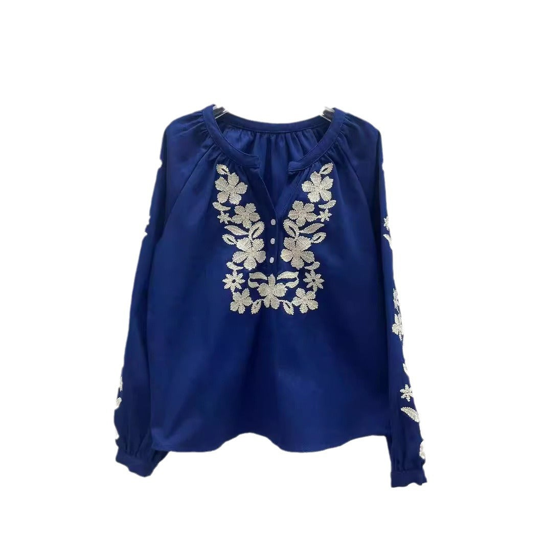 Dame broderet bluse med elegante blomsterdesign og knapliste Stilla