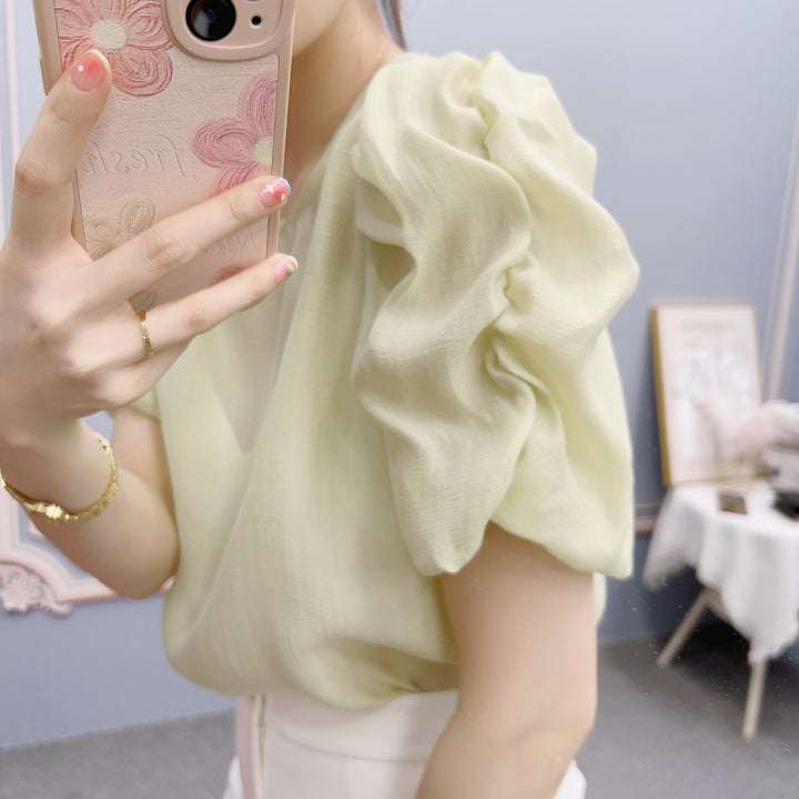 Damebluse med voluminøse puffærmer og elegant snit Stilla