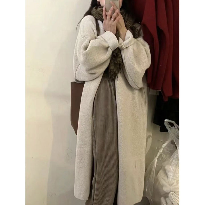 Dame lang strikjakke med oversized pasform og blødt fleecefor