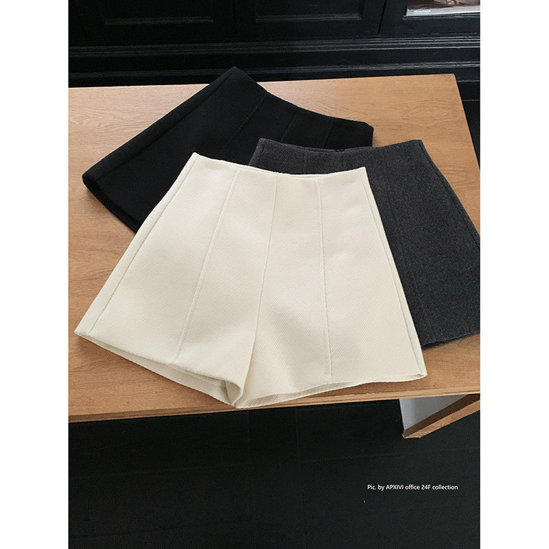 Dame shorts i det elegante houndstooth-mønster med høj talje og folder Stilla