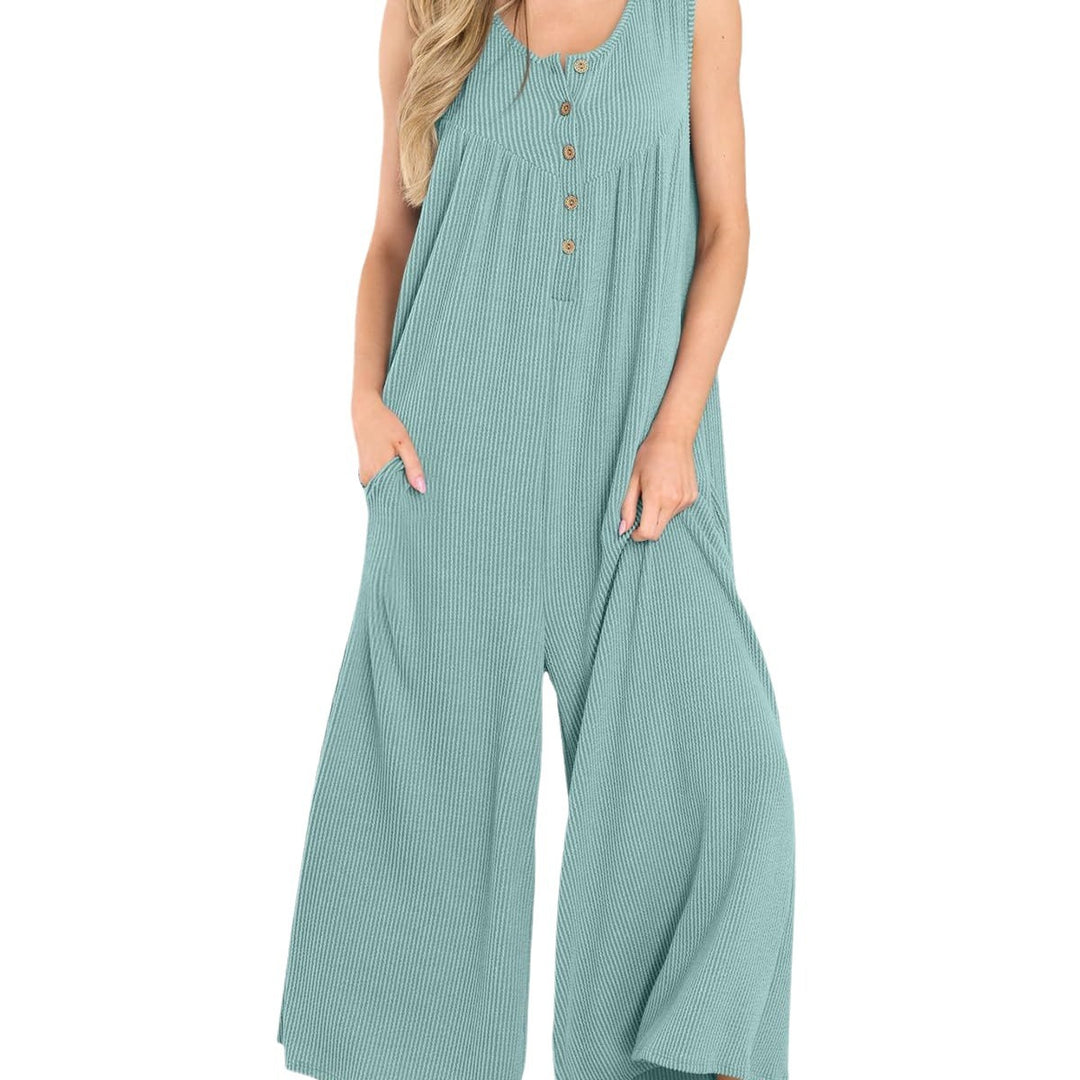 Dame afslappet jumpsuit med knapdetaljer og bredt skåret ben Stilla
