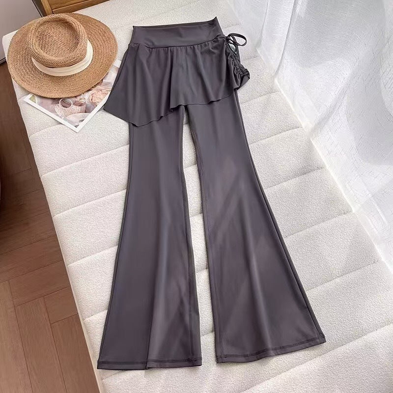 Kvinders flairbukser med asymmetrisk snit og høj talje Stilla