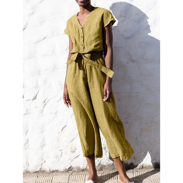 Dame let jumpsuit med taljebind og knapdetaljer Stilla