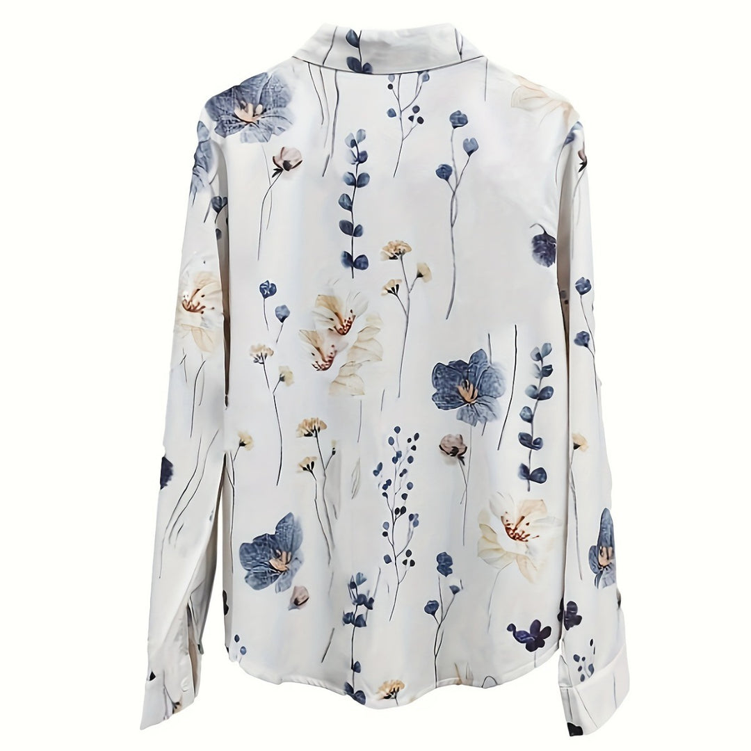 Damebluse med blomstertrykt og lange ærmer med knaplukning Stilla