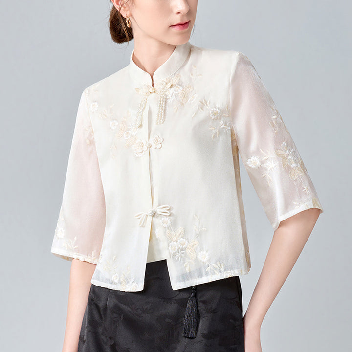 Dame Kortærmet Bluse med kunstnerisk Floralbroderi og elegant Ståkrave Stilla
