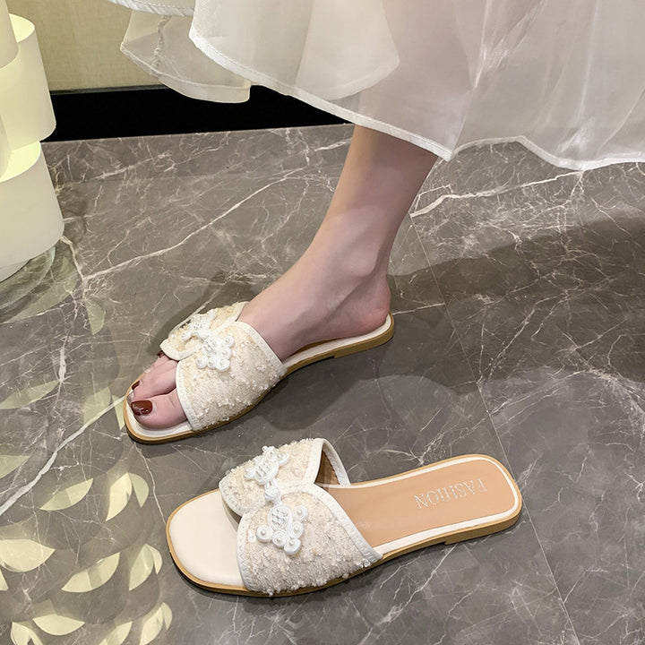 Dame nan elegante mule med kvadratisk tåparti bouclé-overmateriale og perleudsmykning Skovae