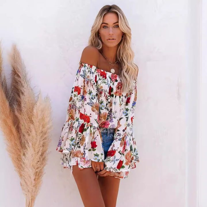 Dame Off-Shoulder Bluse med voluminøse ærmer og florale accenter Stilla