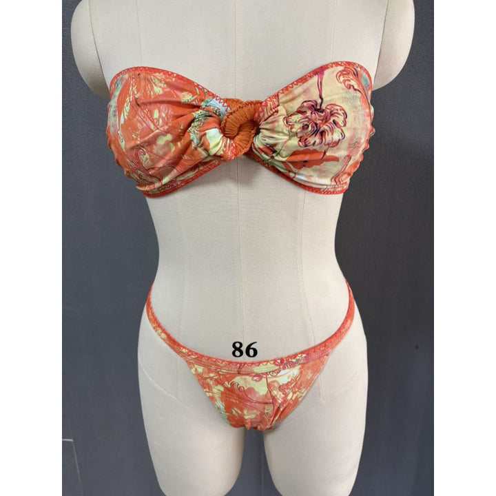 Dame strandkjole med floral vikledetalje og raffineret binding