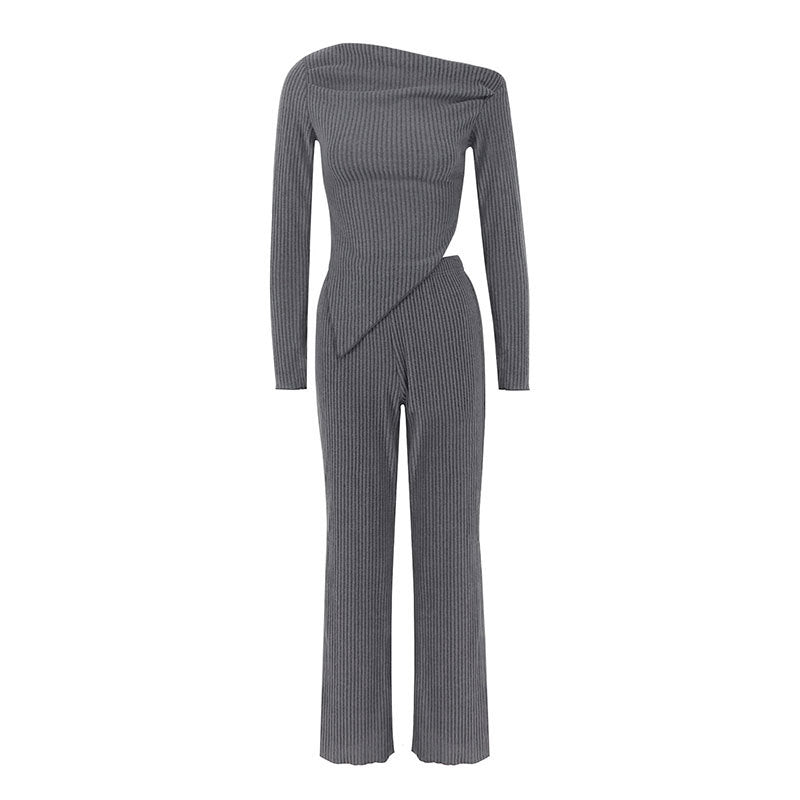 Dame tætsiddende jumpsuit med asymmetrisk udskæring og lange ærmer Skovae