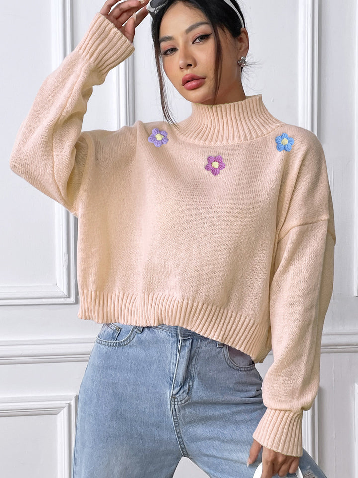 Dame elegant strikpullover med blomstret design og høj krave Stilla