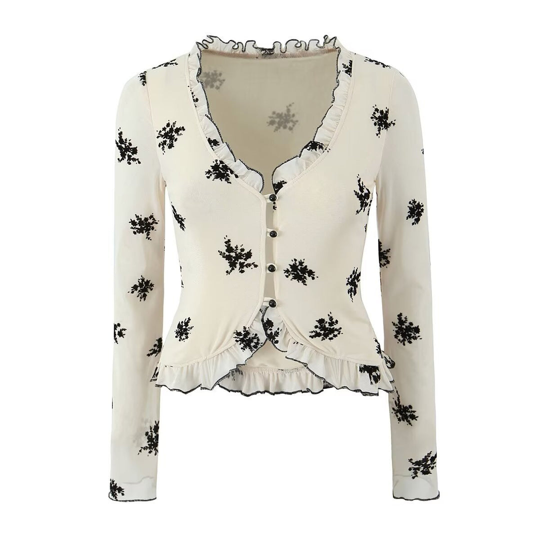 Damebluse med blomstret design og flæsedetaljer Stilla