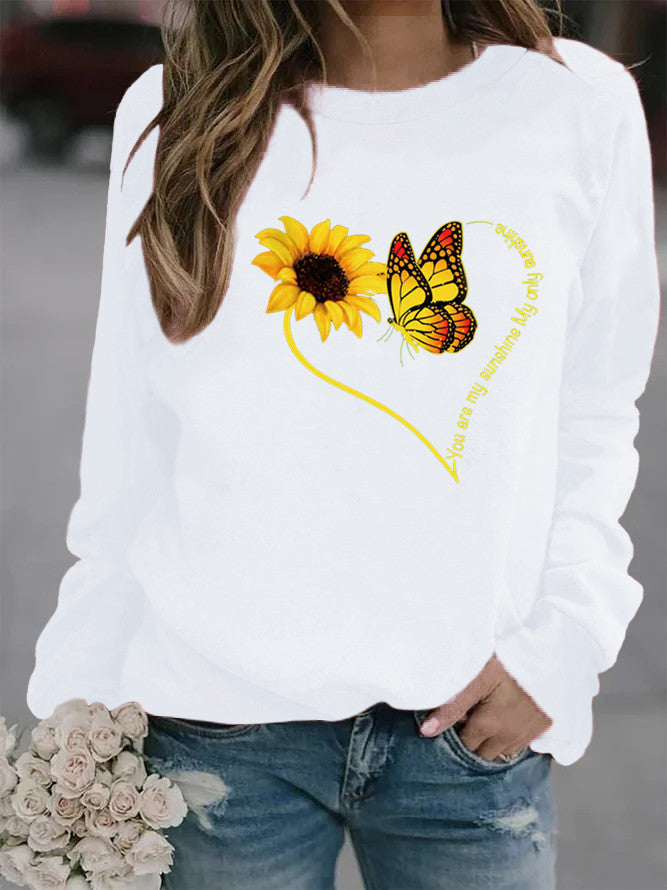 Kvinders sweatshirt med grafisk sommerfugl og solskinsmotiv Stilla