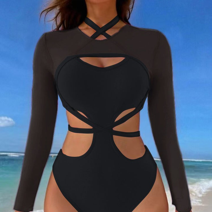 Dame et-stykke badedragt med raffineret cut-out design og lange ærmer Stilla