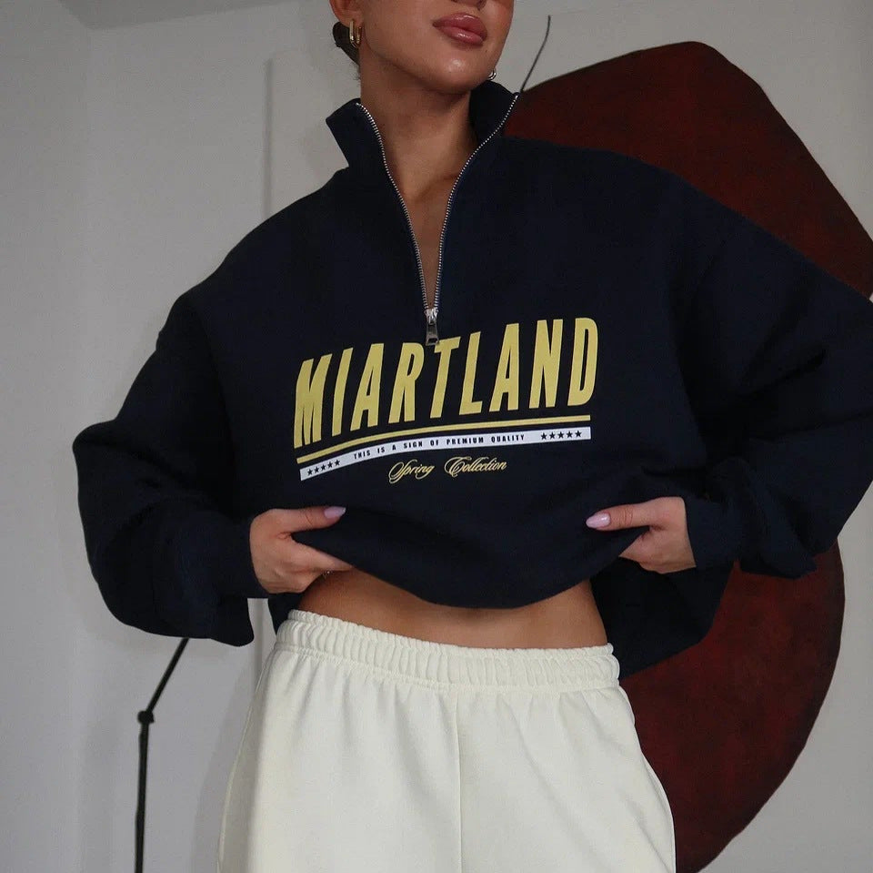 Kvindernes sporty zip pullover med oversize pasform og kreativt print Stilla