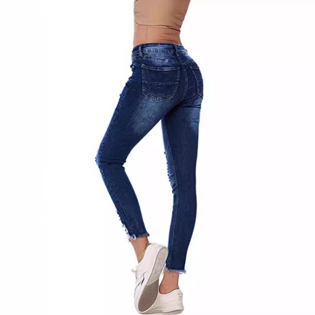 Dame Skinny Jeans med modetrend Destroyed-effekt og figurskærende snit Stilla