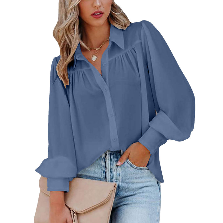 Dame elegant bluse med voluminøse ærmer og knapdetaljer Stilla