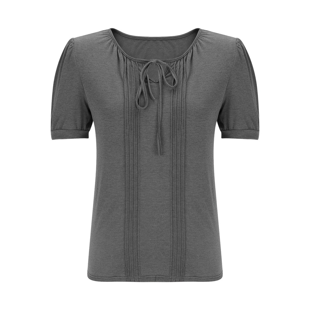 Damebluse med puffærmer og raffineret halterneck Stilla