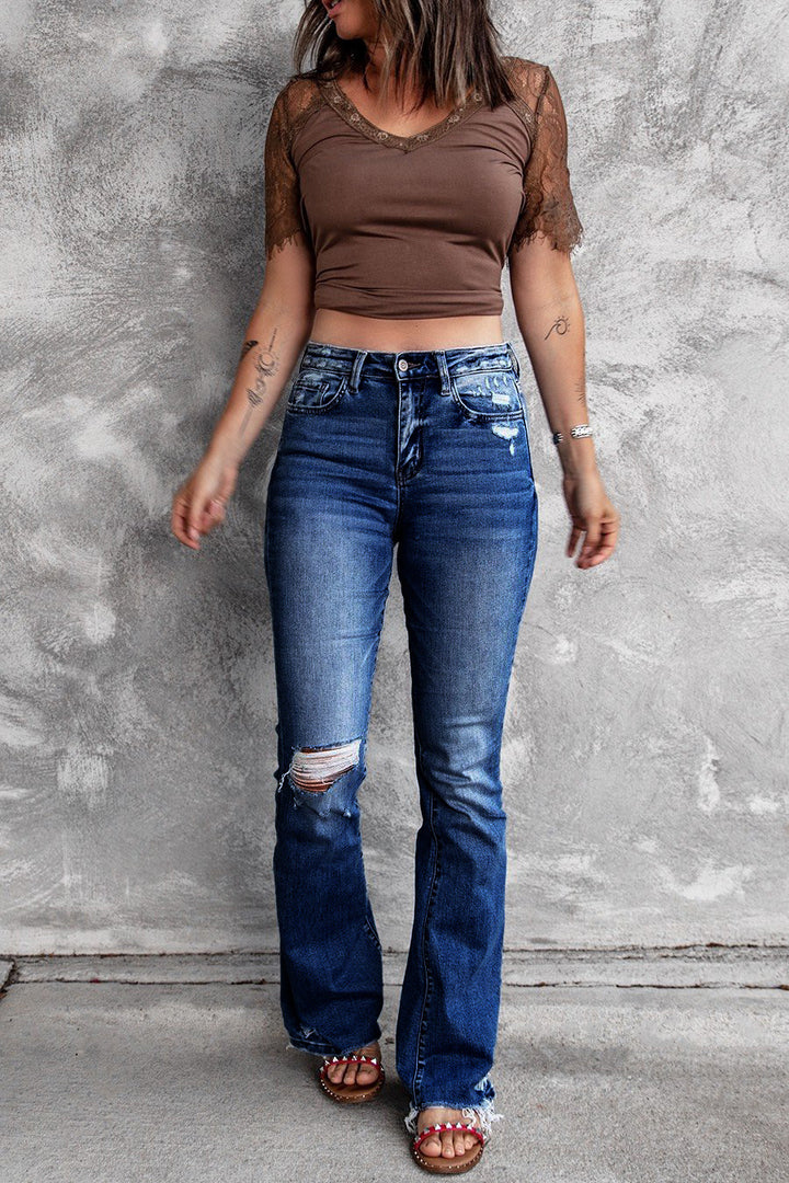 Dame brede flared jeans med moderigtige destroyed-look og høj talje Stilla