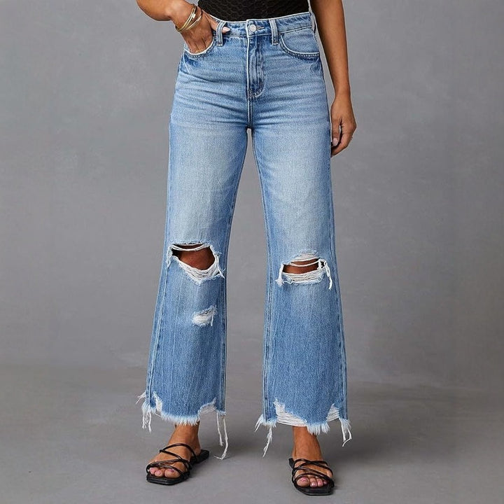 Dame flared jeans med stilfulde rifte detaljer og frynset kant Skovae