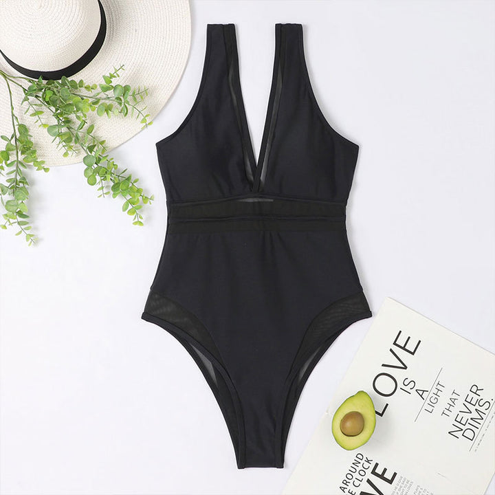 Damer One-piece badedragt med dyb V-udskæring og elegante transparentdetaljer Skovae