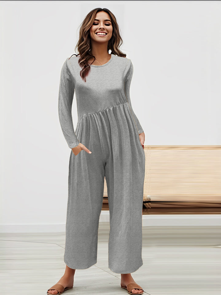 Dame mode jumpsuit med glitrende overdel og vidt skåret ben Stilla