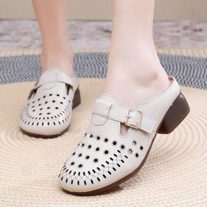 Dame Clogs med perforeret design og elegant spænde Stilla
