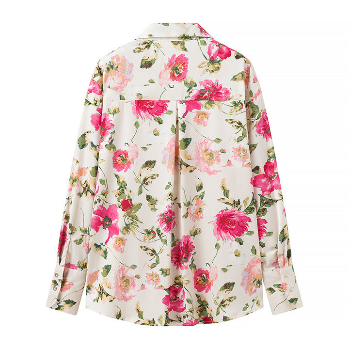 Damebluse med blomsterprint og elegant knapliste Stilla